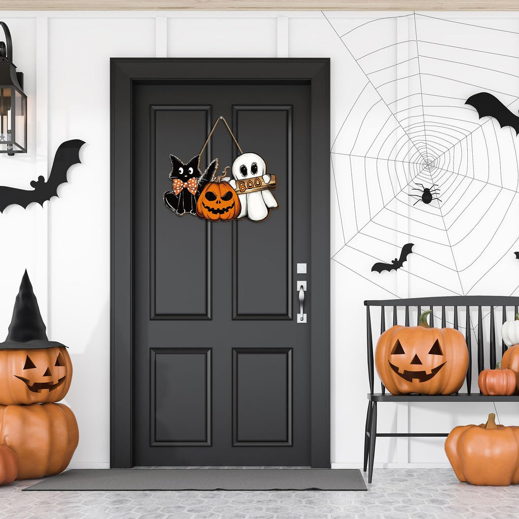 Halloween door sign with black cat, pumpkin, and ghost hanging on a black door with spiderweb decor