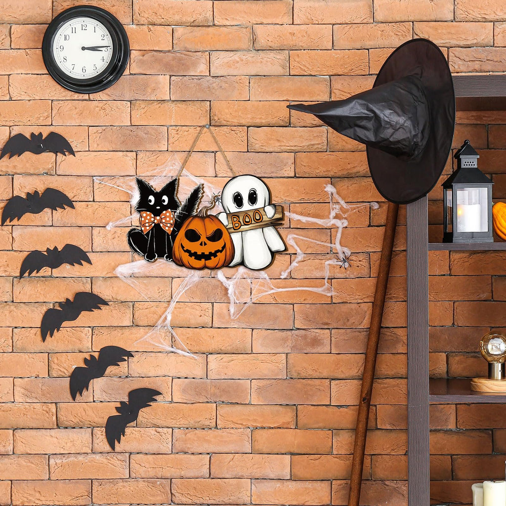 Halloween hanging door sign with black cat, pumpkin, and ghost figures on a brick wall with bats and cobwebs.