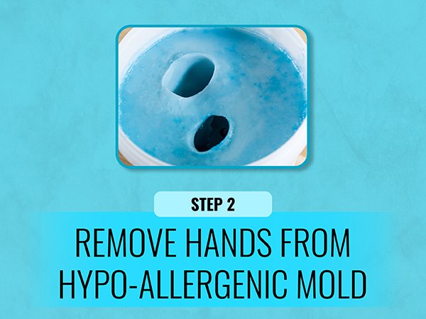 Hand casting mold with two hand impressions, showing step 2 of removing hands from the hypoallergenic mold.