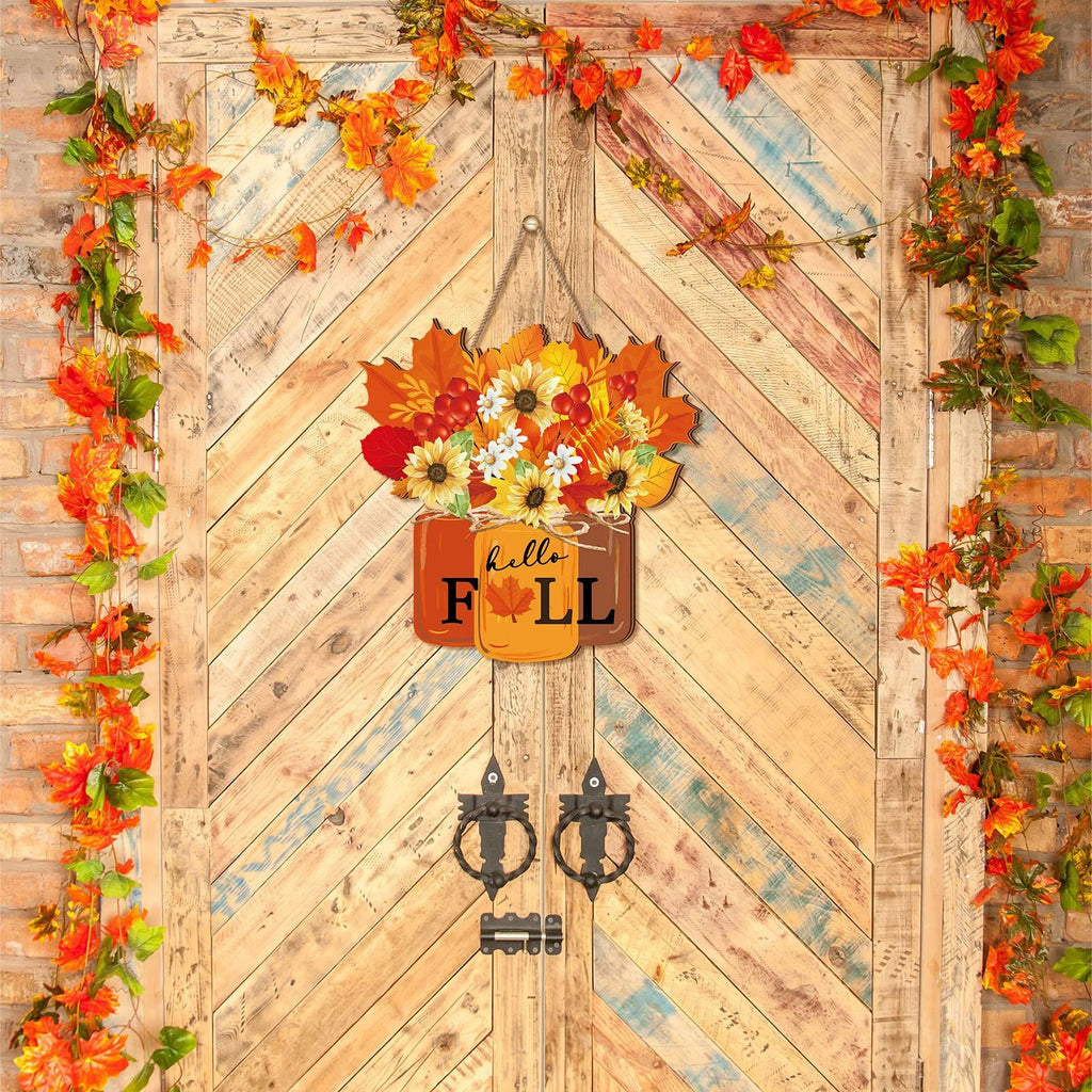 Autumn door sign with sunflowers, daisies, and maple leaves hanging on a wooden door with brick and vine accents.