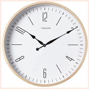 Round clock face with black hour and minute hands, Arabic numerals, and brand name.