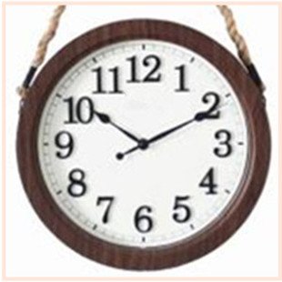 Round wall clock with dark wood frame and white face showing black Arabic numerals and black hour and minute hands.