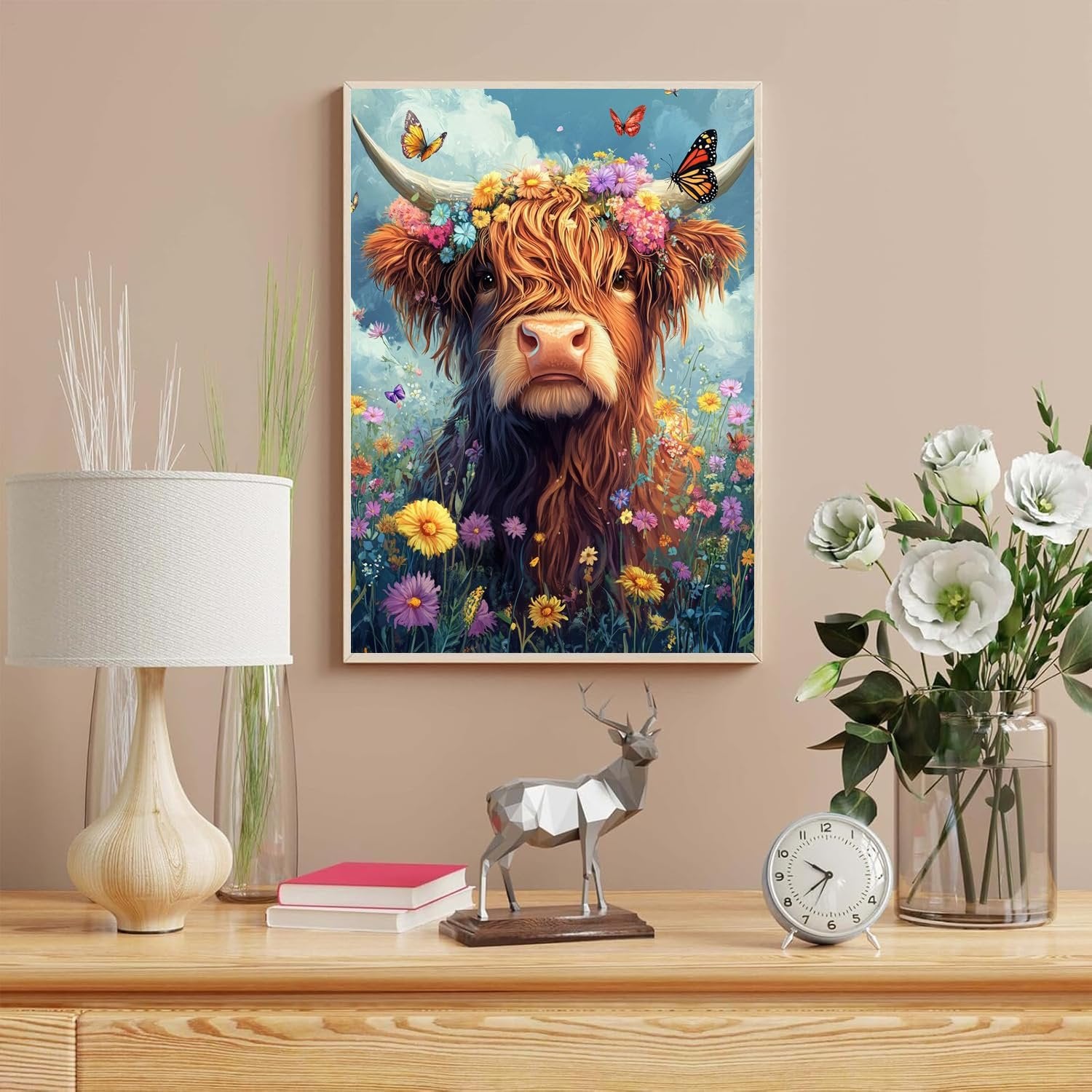 Highland cow with flower crown and butterflies in a field of flowers, framed artwork