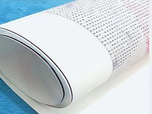 Rolled up diamond painting kit canvas with protective white band and silver trim