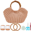Crochet bag kit with peach yarn, bamboo handles, crochet hook, scissors, and tape measure on white background.