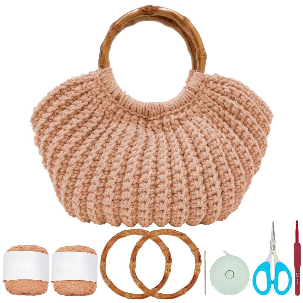 Crochet bag kit with peach yarn, bamboo handles, crochet hook, scissors, and tape measure on white background.