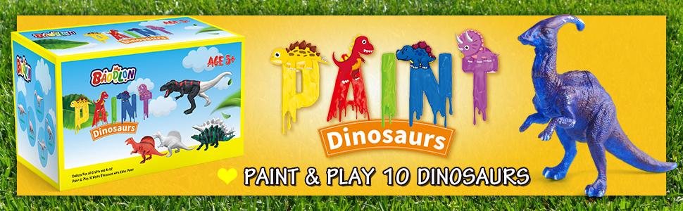 Dinosaur painting craft kit box and painted dinosaur figurines on a yellow background with grass border