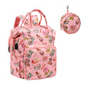 Pink backpack with a floral and cosmetic print, shown with a matching round pouch. The backpack has a USB port.
