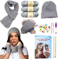 Knitting starter kit contents including scarf, hat, fingerless gloves, yarn, needles, stitch markers, and instruction booklet.