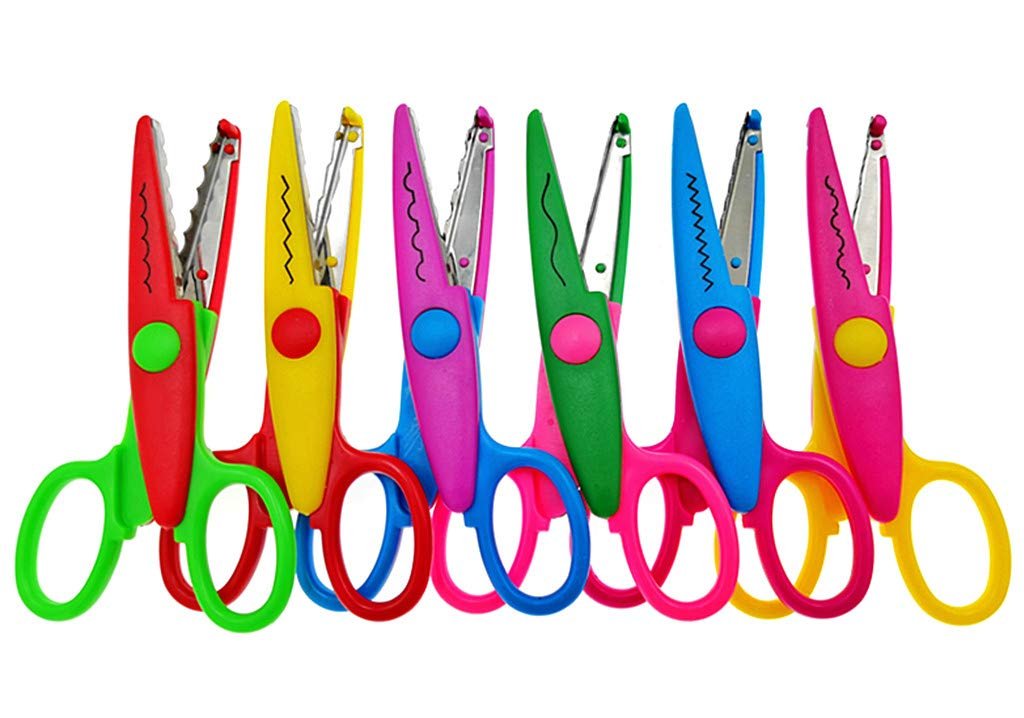 Set of six decorative scissors with different wavy cutting blades and colorful handles on a white background.