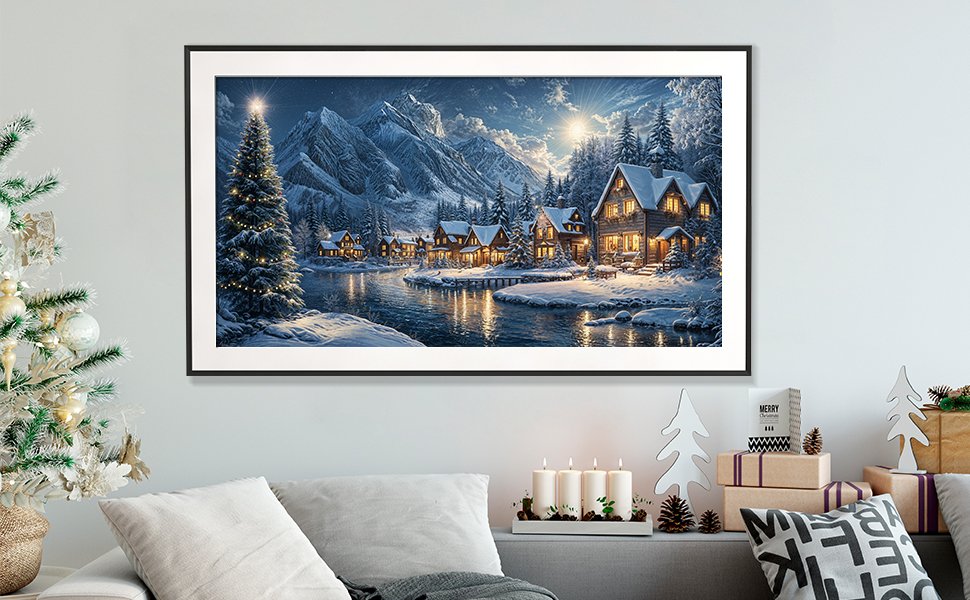 Framed diamond art kit depicting a snowy village scene with a Christmas tree and mountains.