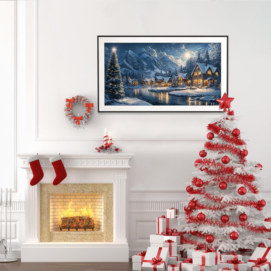 Cozy Christmas scene with a fireplace, stockings, a decorated tree, and gifts, featuring a framed winter village landscape painting.