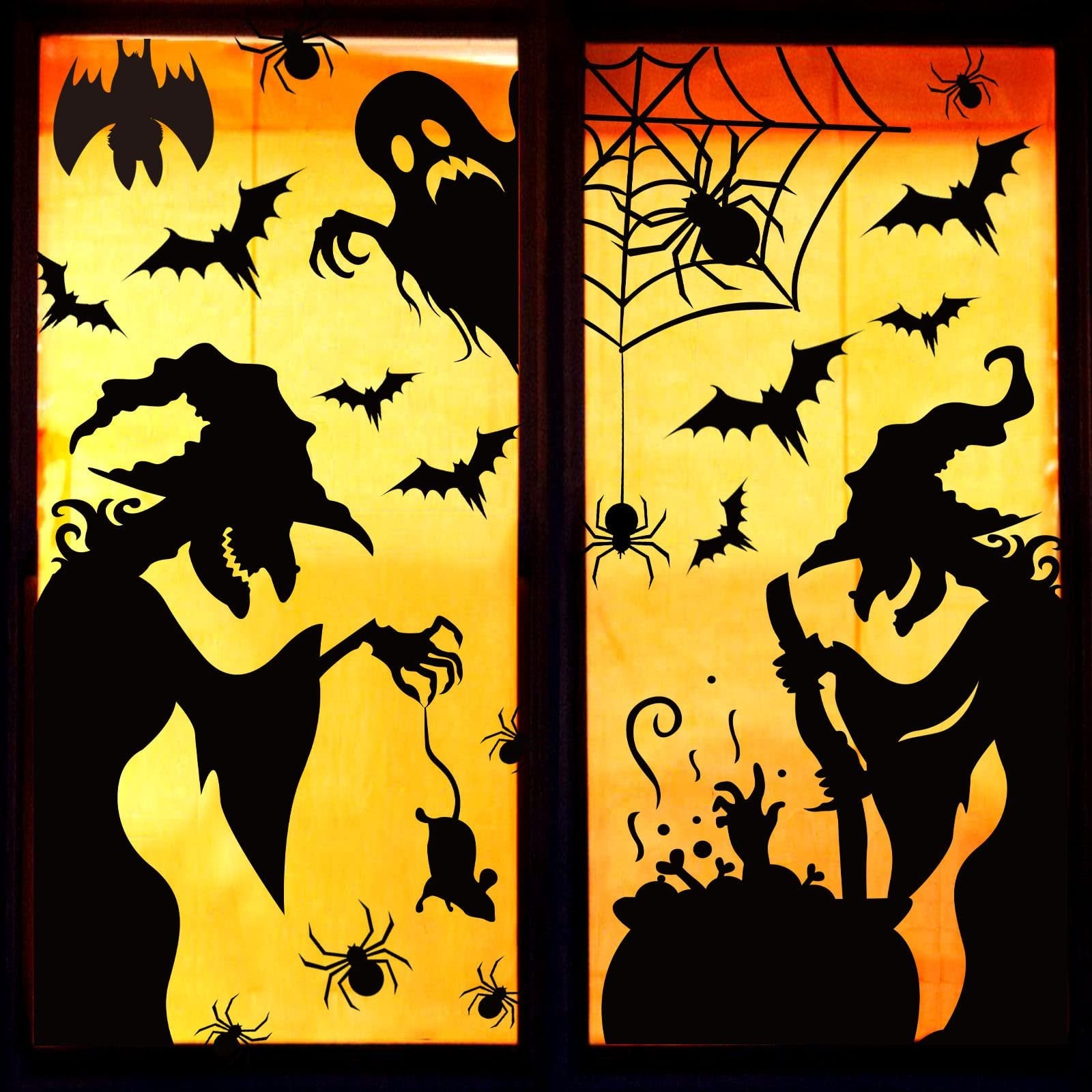 Halloween window clings featuring witches, bats, spiders, a ghost, and a cauldron on a yellow-orange background.