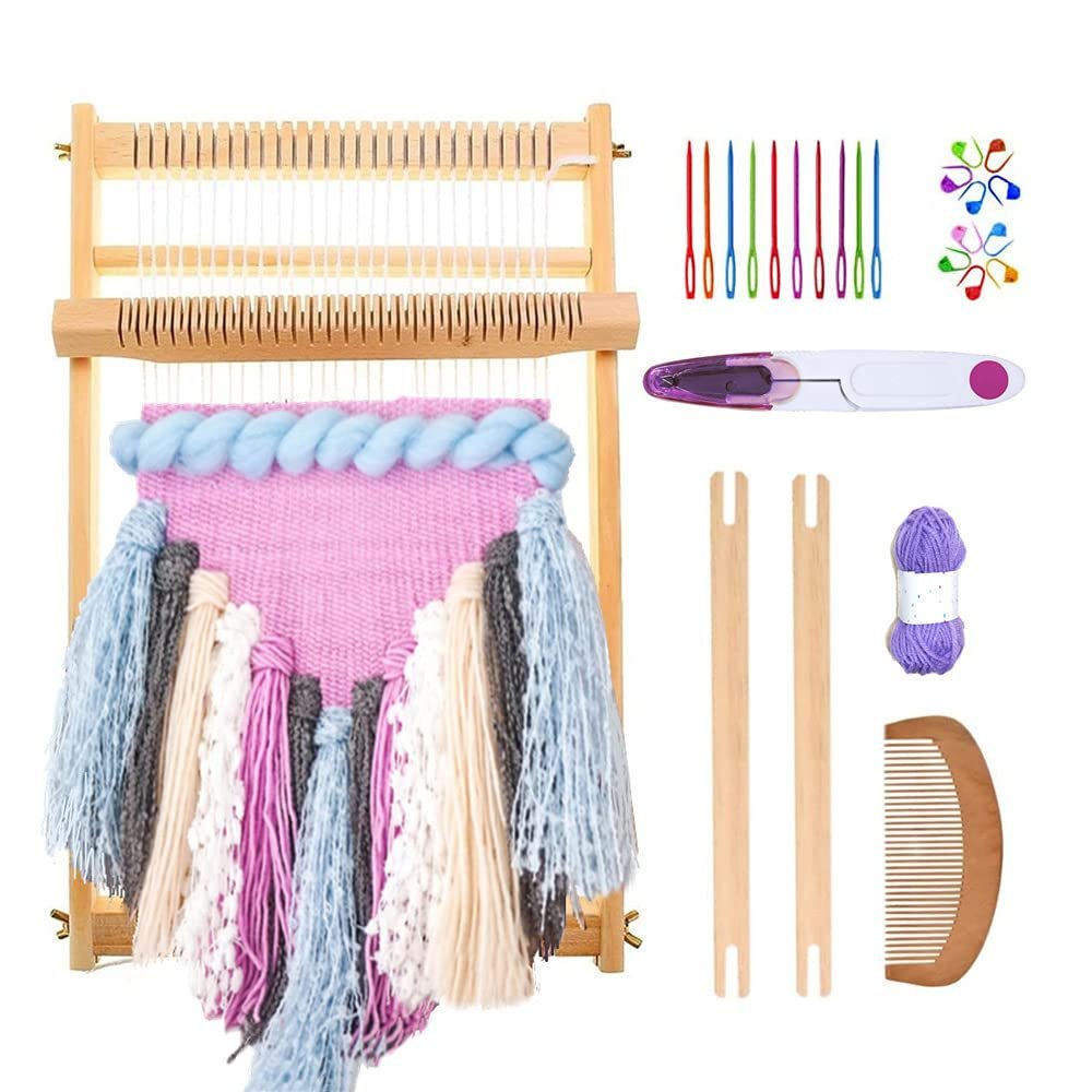 Wooden weaving loom with colorful yarn and accessories, including needles, scissors, and comb.