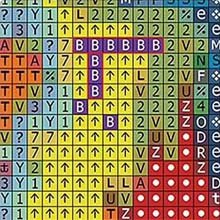 Diamond painting grid with symbols and colors, close-up view of a section.