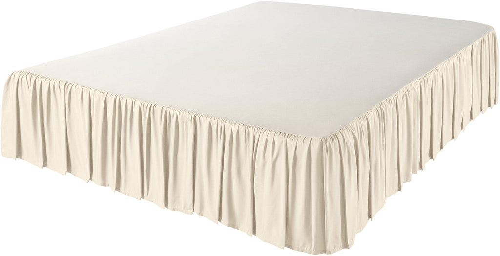 Queen size bed skirt with ruffled drop in a light cream color, shown from a three-quarter angle on a white background.