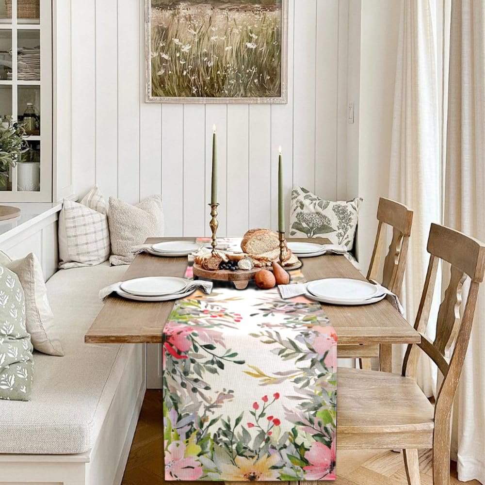 Watercolor floral table runner on a dining table set for a meal with bread and cheese