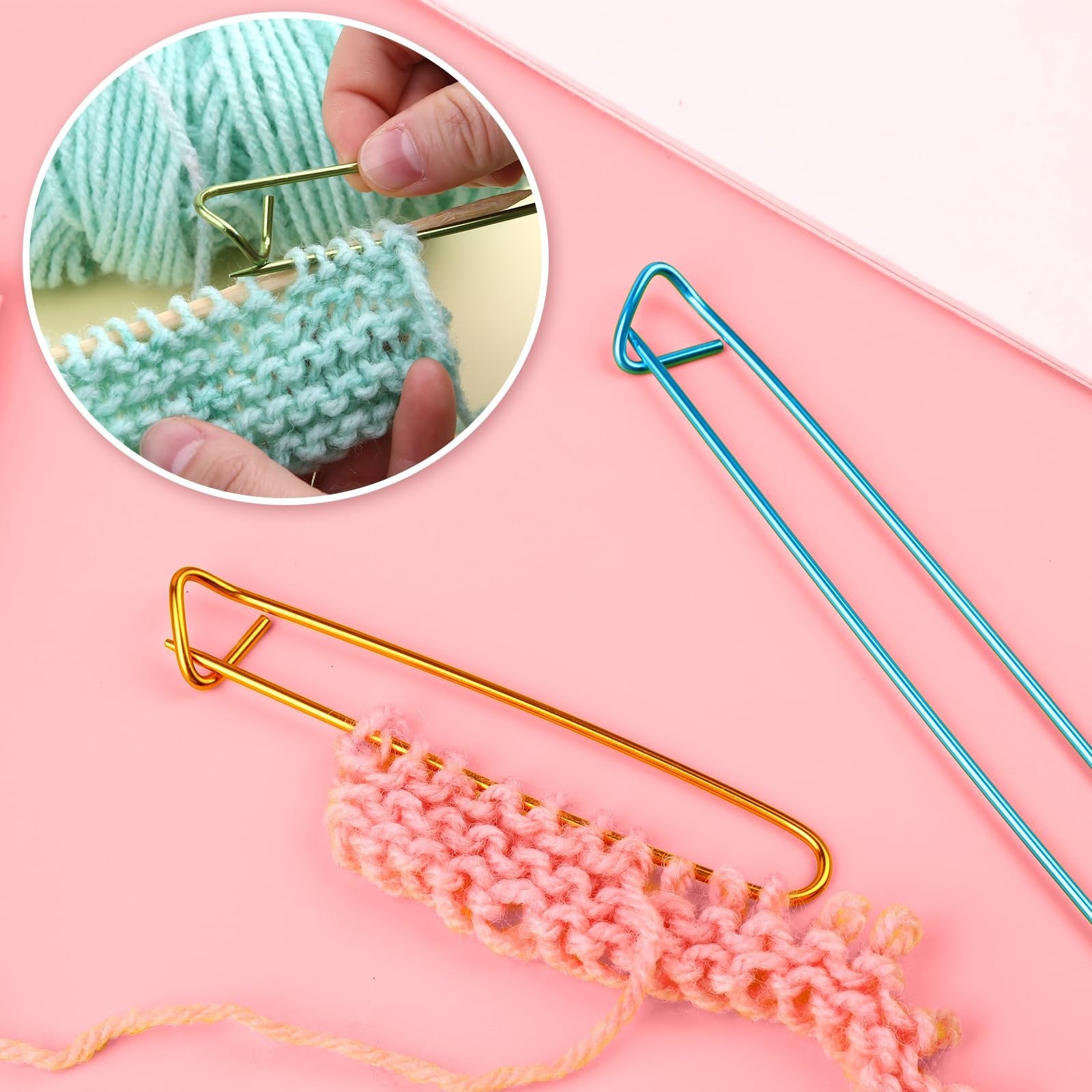 Knitting needles and stitch holders with yarn and knitted swatches on a pink background