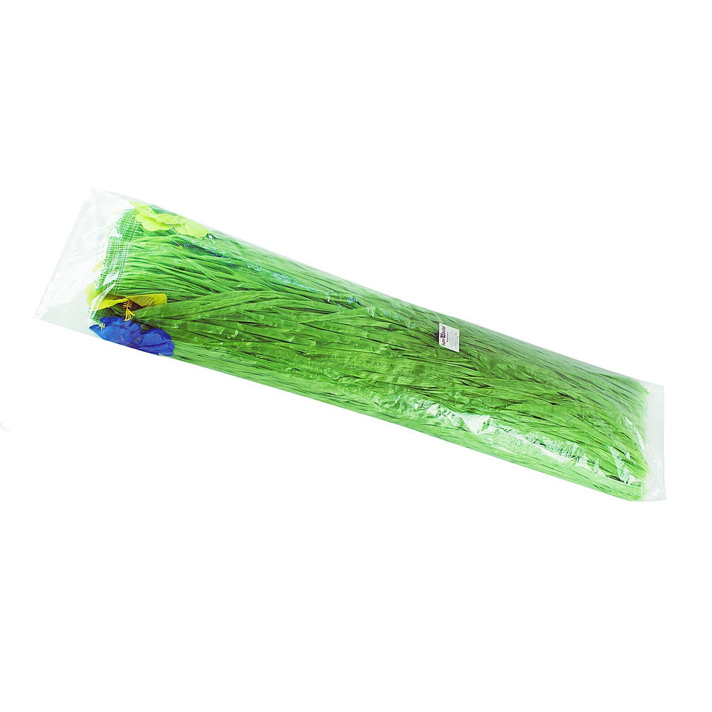 Green luau grass table skirt with silk hibiscus flowers in plastic packaging, angled view.