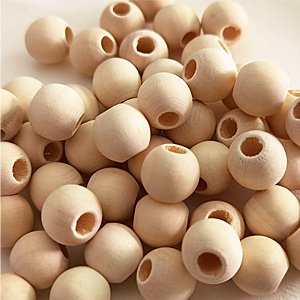 Pile of unfinished wooden beads with large holes for crafting