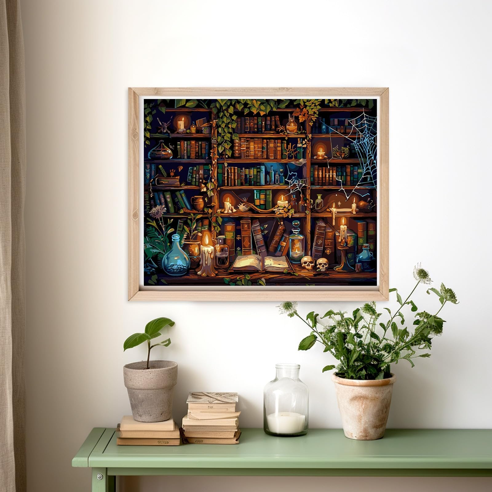 Framed paint by numbers artwork depicting a magical library with bookshelves, candles, skulls, and spiderwebs.