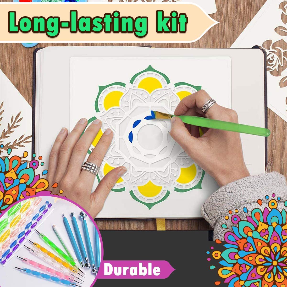 Hands painting a mandala stencil with blue paint and a green brush, with dotting tools and stencils visible in a corner.