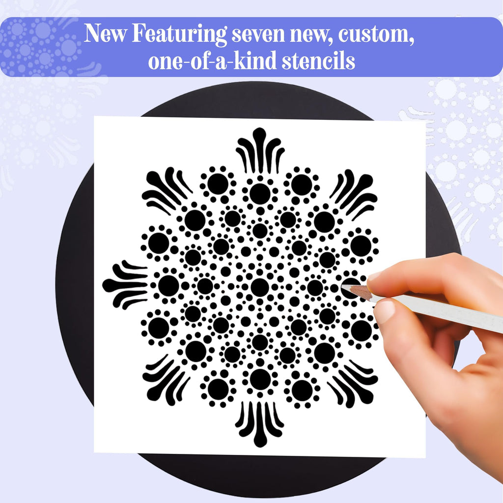 Mandala painting stencil being used by a hand with a dotting tool on a black board.