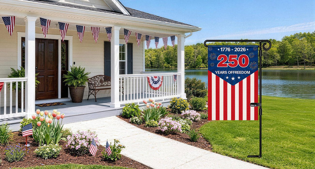 Metal garden flag stand with a patriotic flag displaying '250 Years Of Freedom' in front of a suburban house.