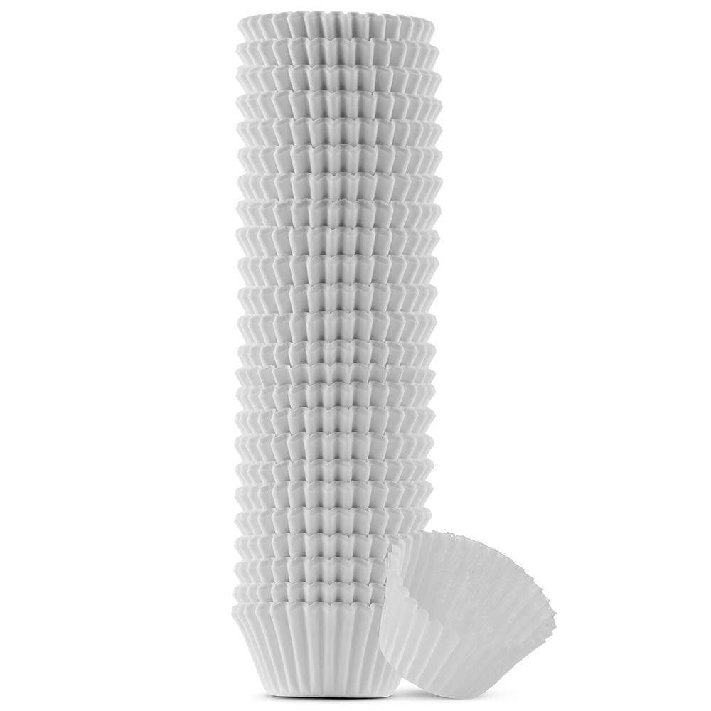 Stack of mini white cupcake liners with one liner tilted on its side, isolated on white background.