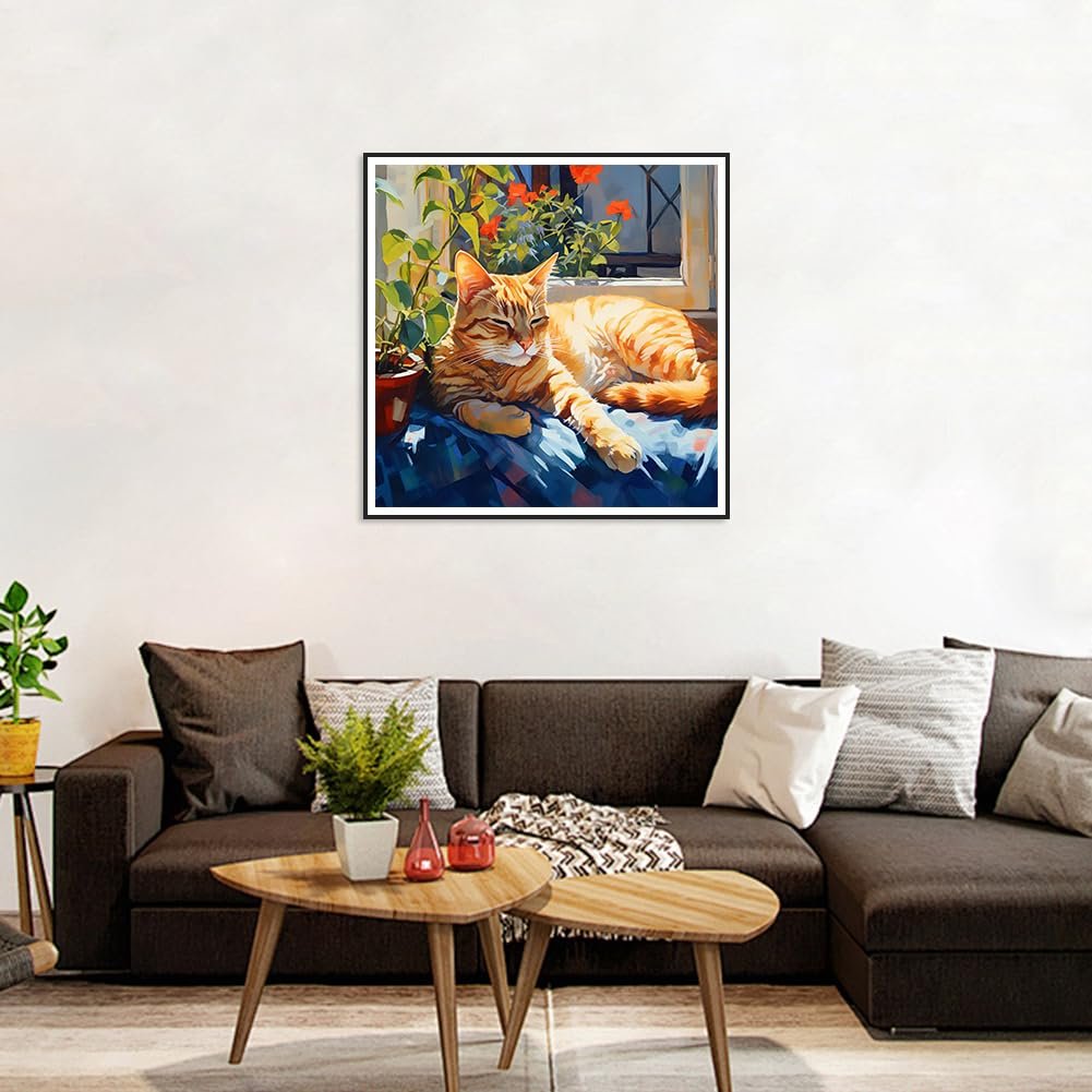 Orange tabby cat napping on a blue blanket in front of a window with plants