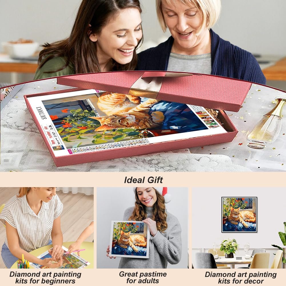 Two women opening a diamond painting kit featuring a napping cat. The kit is in a pink box.