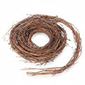 Rolled grapevine twig garland on a white background, showing natural brown branches and vines.
