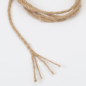 Natural jute twine with frayed ends, coiled on a white background.