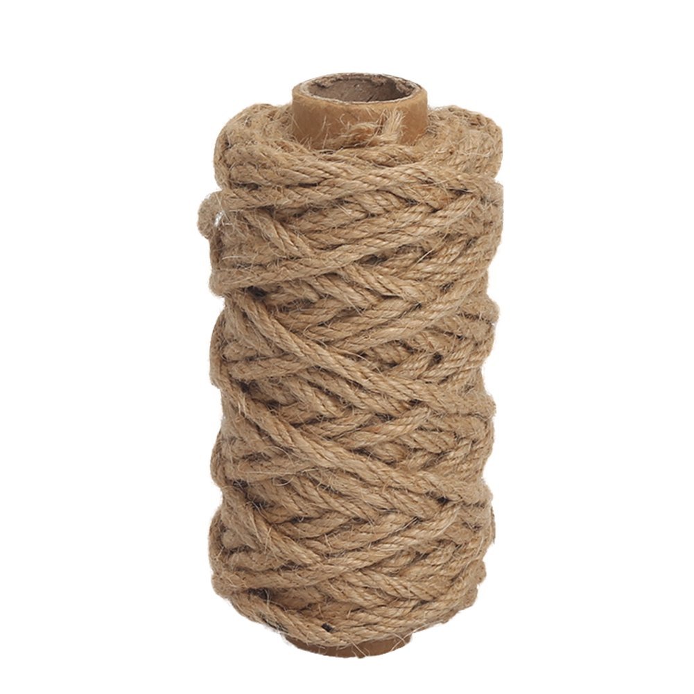 Roll of thick natural jute twine on a cardboard tube, isolated on white background.