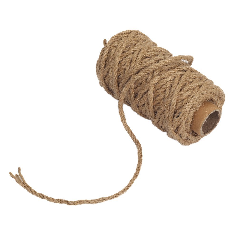 Roll of natural jute twine with a loose end on a white background