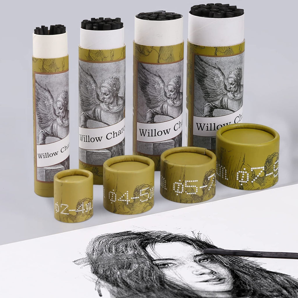 Assortment of willow charcoal sticks in cylindrical packaging with artistic designs, alongside a sketch of a face with a charcoal stick.