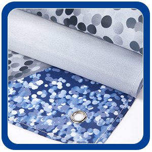 Close-up of a rolled-up fabric banner with a blue and white confetti pattern and a metal grommet.