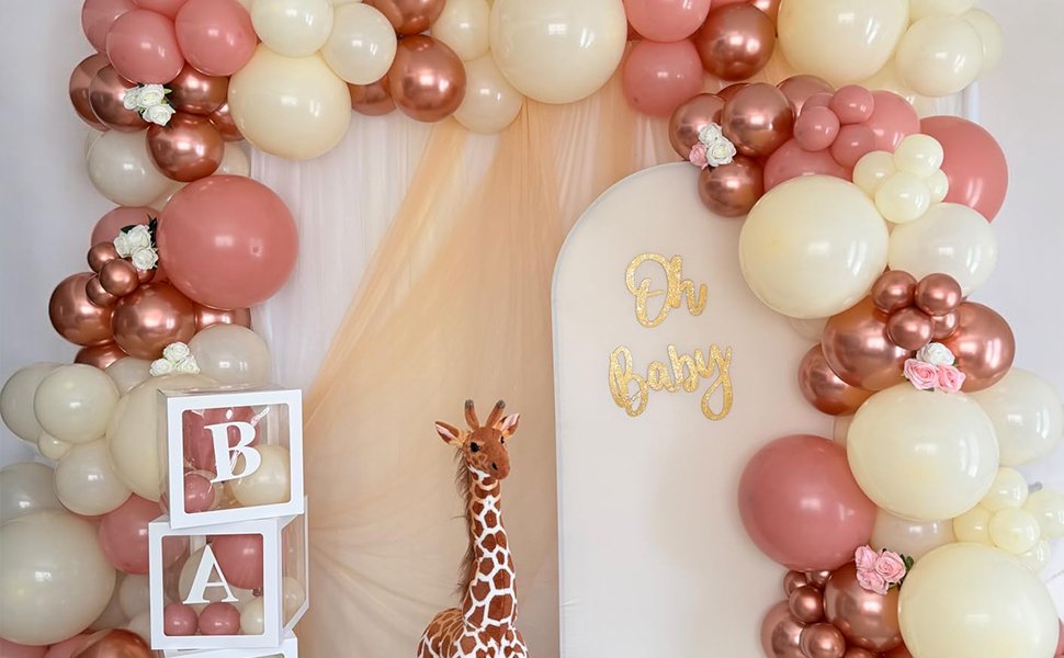 Balloon arch with 'Oh Baby' sign and giraffe for a baby shower party setup