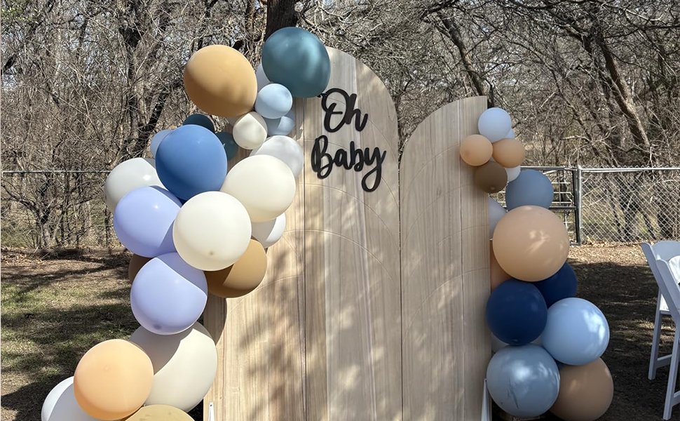 Wooden arch backdrop with 'Oh Baby' text and balloon garland for a baby shower