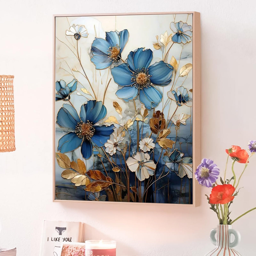 Framed paint by numbers artwork featuring blue and white flowers with gold accents, displayed on a wall.