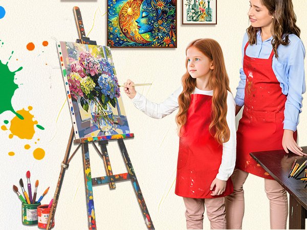 Woman and child in red aprons painting flowers on canvas at an easel, with art supplies and other paintings visible.