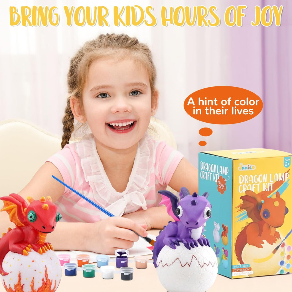 Smiling girl painting a dragon lamp craft kit with 12 colors and brushes