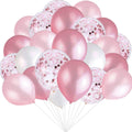 A cluster of pink, white, and confetti balloons on white sticks against a white background.