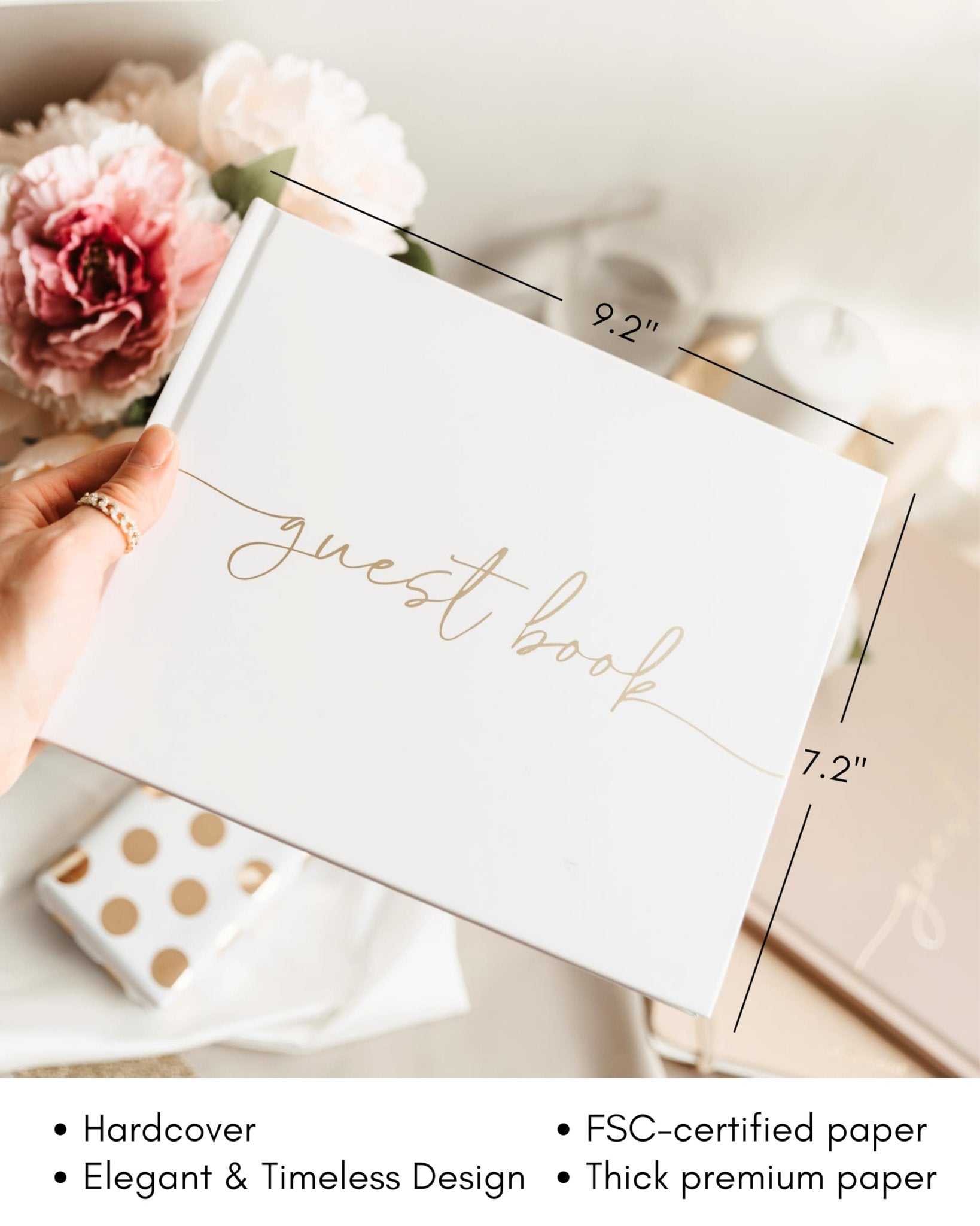 White hardcover guest book with gold script text, shown with flowers and dimensions 9.2" x 7.2".