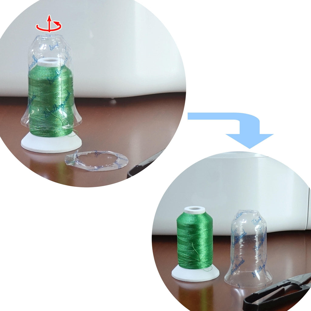 Green polyester embroidery thread spool with clear plastic cover and red rotation arrow, next to a spool without cover and scissors.