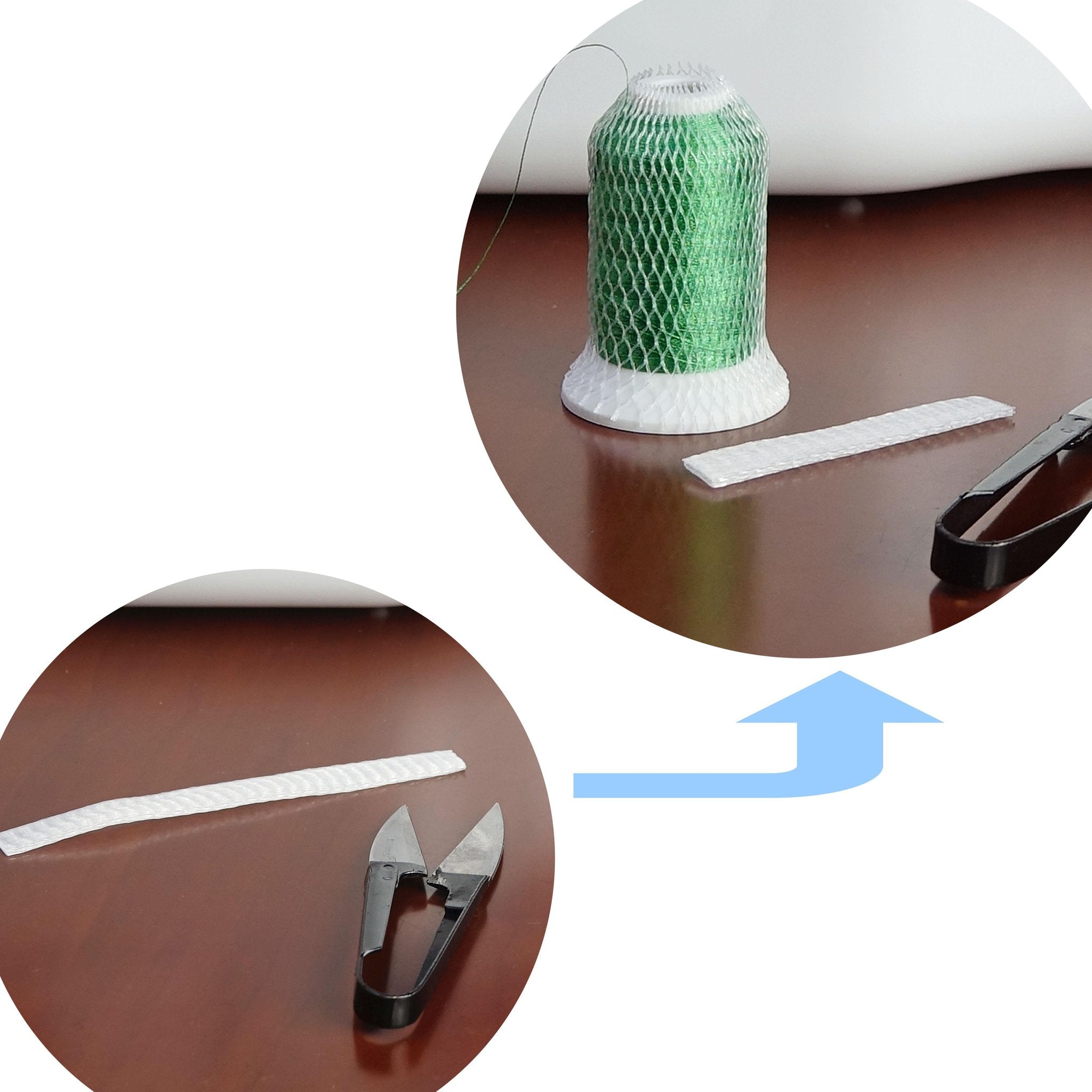 Spool of green embroidery thread with netting and a pair of small scissors
