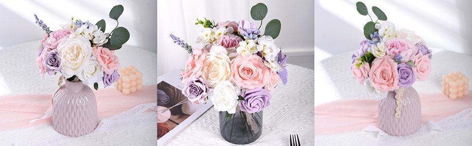 Assortment of artificial silk flowers in pastel pink, purple, and white hues arranged in vases, with decorative candles nearby.