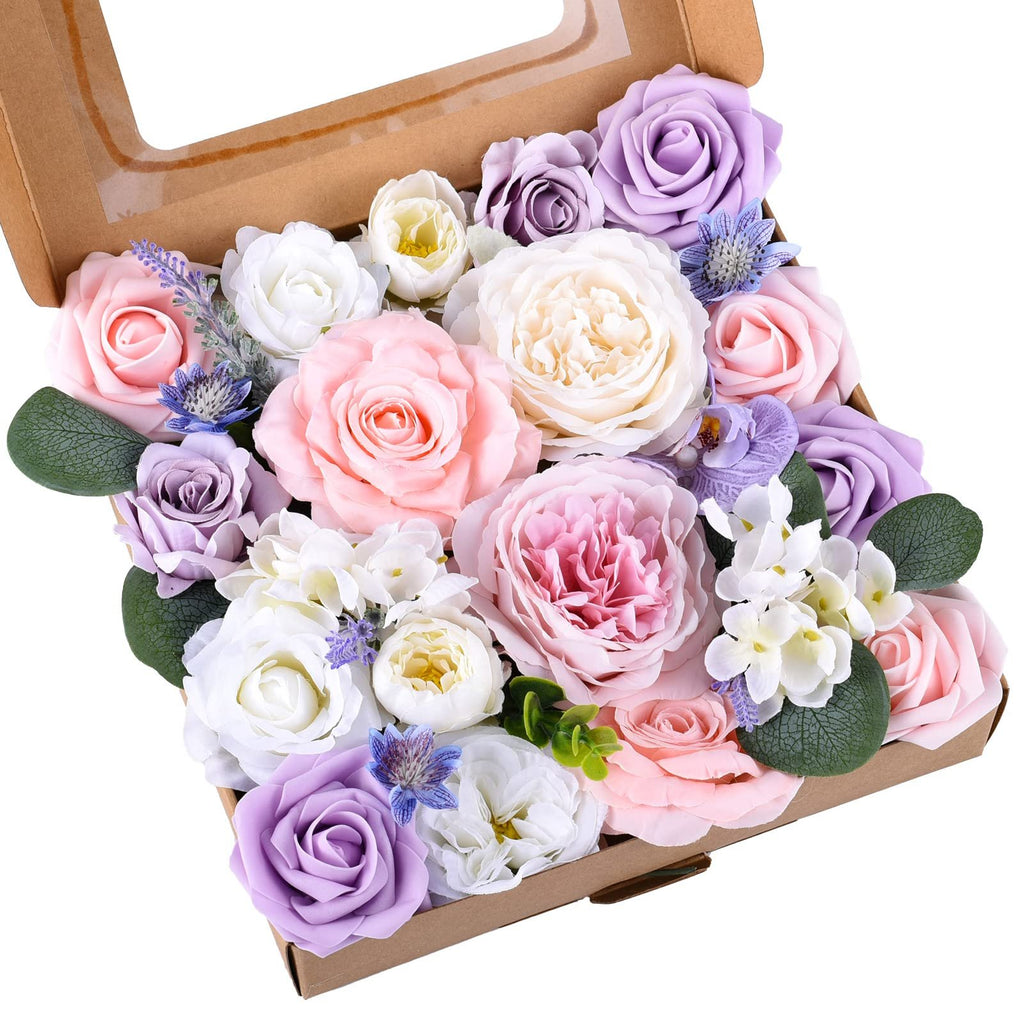 Box of assorted artificial silk flowers in pink, purple, and white hues, arranged for DIY projects.