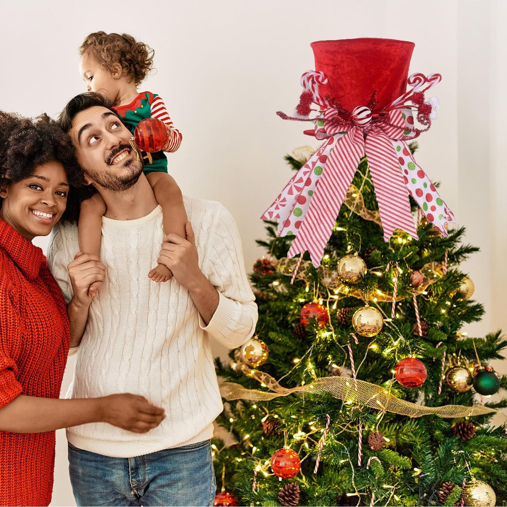 Family celebrating Christmas with a red velvet candy cane tree topper hat on the tree