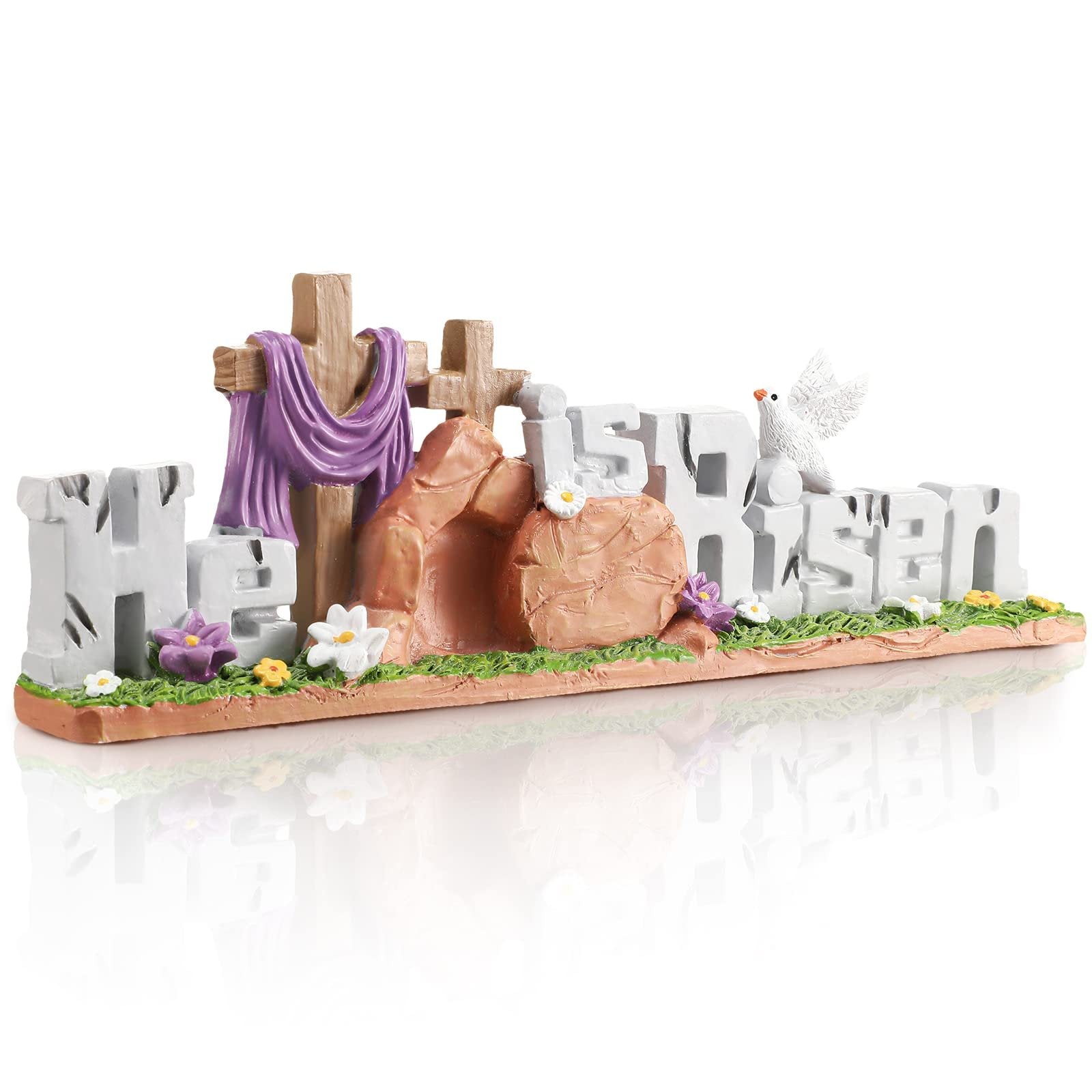 Easter figurine depicting the words 'He is Risen' with crosses, a tomb, and a dove, on a grassy base with flowers.